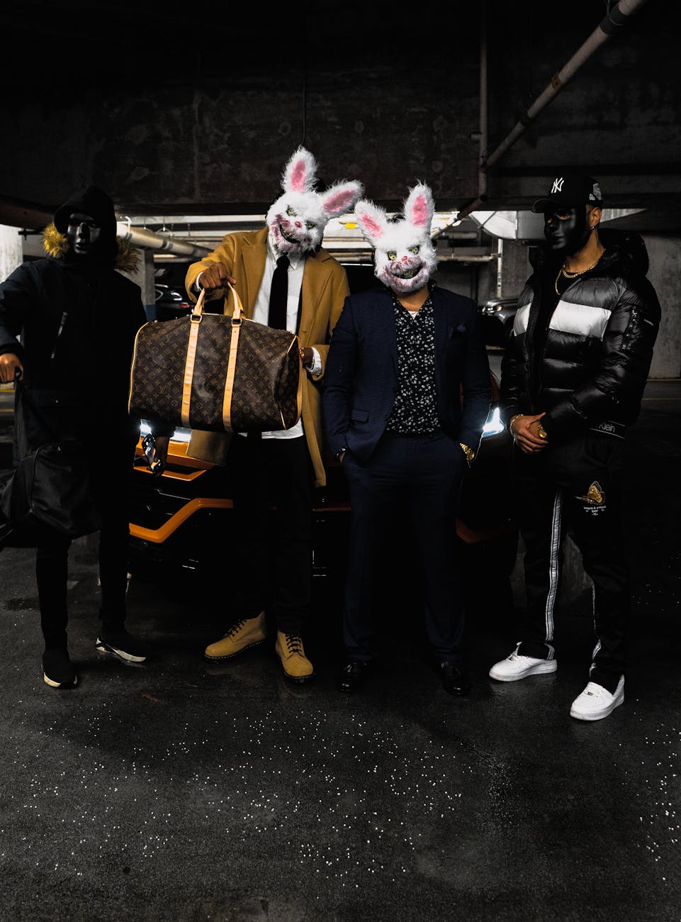 Stock photo of two people wearing creepy bunny masks carrying baggage while flanked by dystopian masked security from Pexels.com