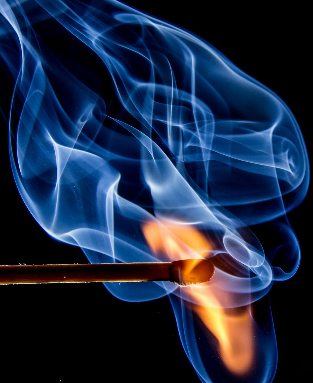 Stock photo of an igniting match head with yellow core and blue abstract outgoing energy waves from Pexels.com