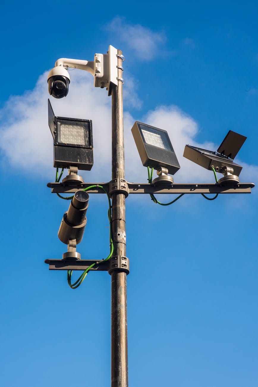 Stock photo of a metal pole tree with a full array of surveillance implements from Pexels.com