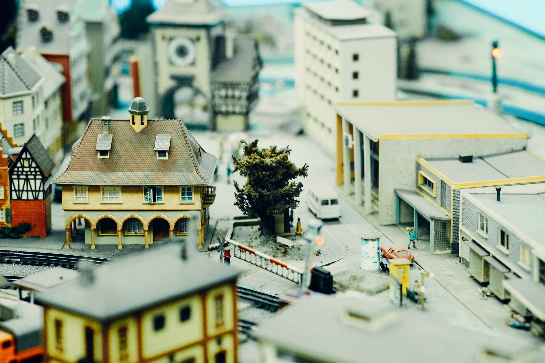 Stock photo of a small model town with a large intrusive entity stalking Main Street from Pexels.com