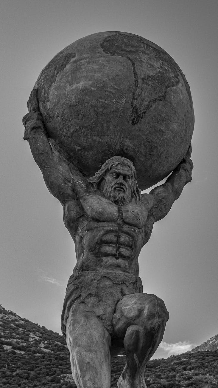 Stock photo of a statue with Atlas holding the world on his shoulders from Pexels.com