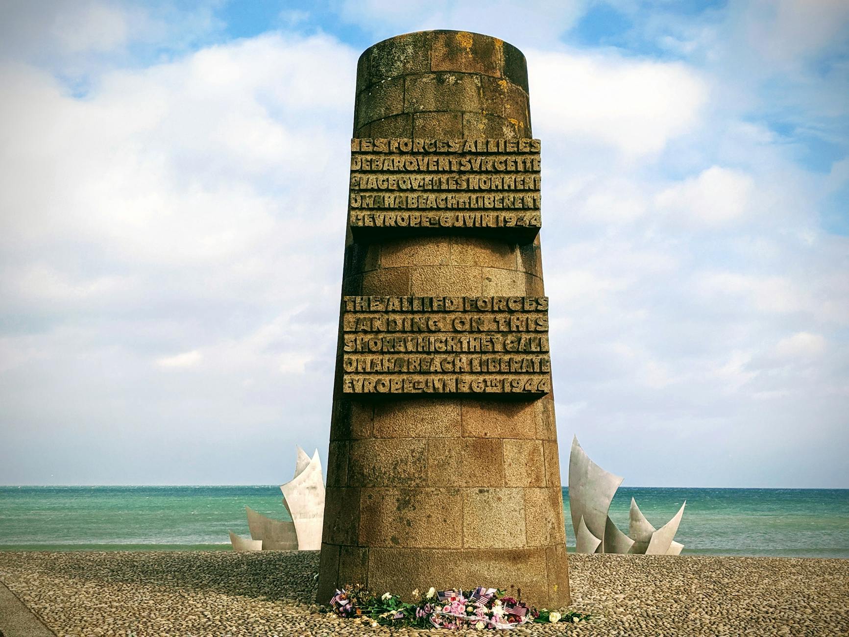 Stock photo of commemorative historical bunker marker and sculptures on Normandy beaches from Pexels.com