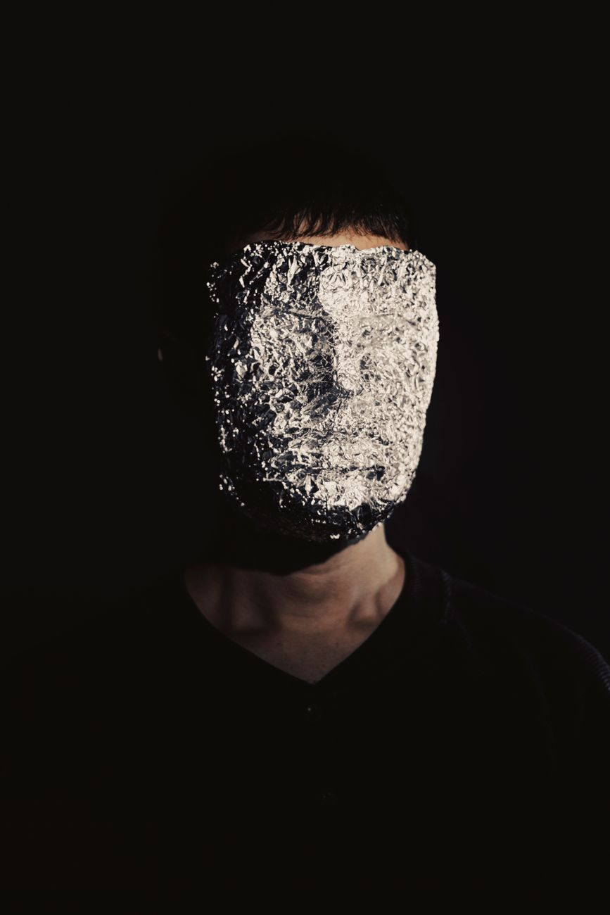 Stock photo of a foil mask over a human face from Pexels.com