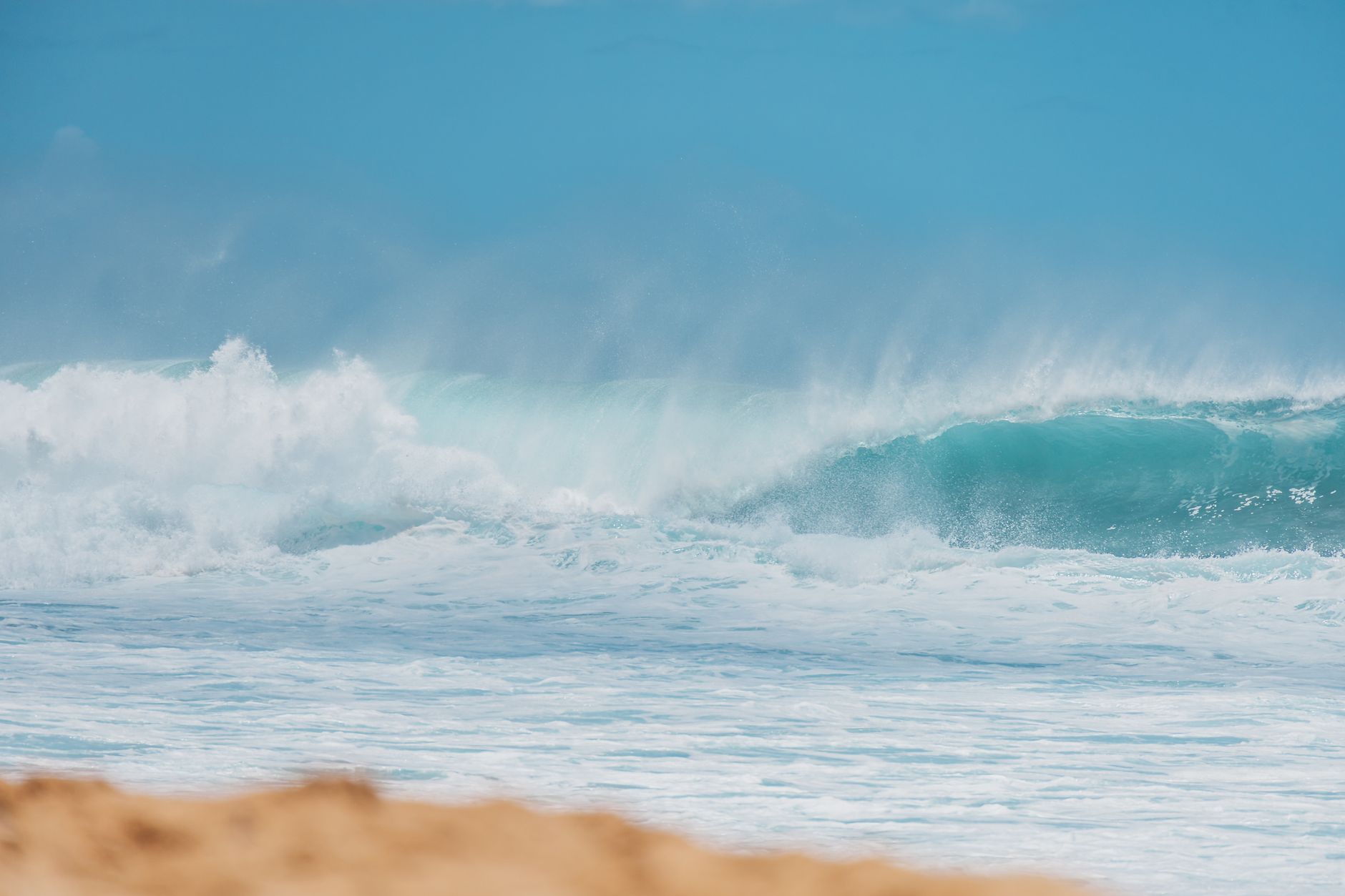 Stock photo of waves rolling toward a sandy shore from Pexels.com