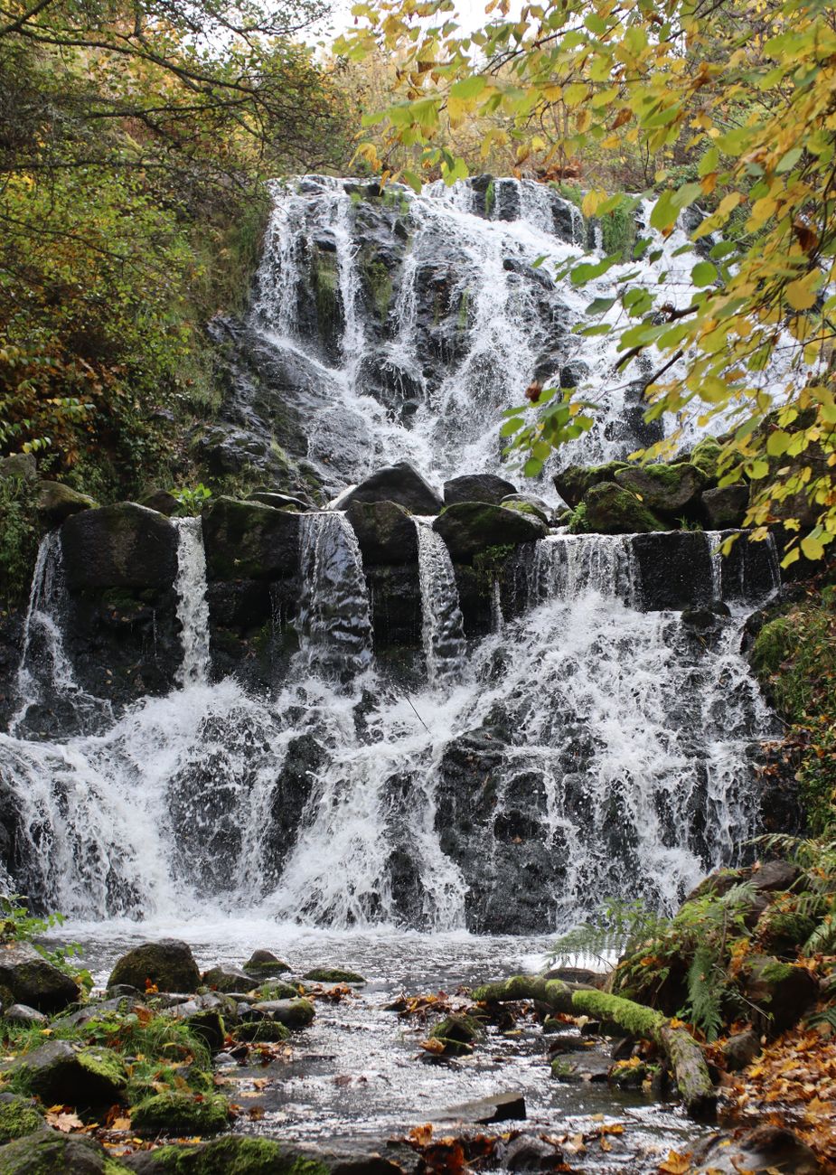 Stock photo of the Röttleån Waterfall, a 12-meter tiered cascade over rocks from Pexles.com 