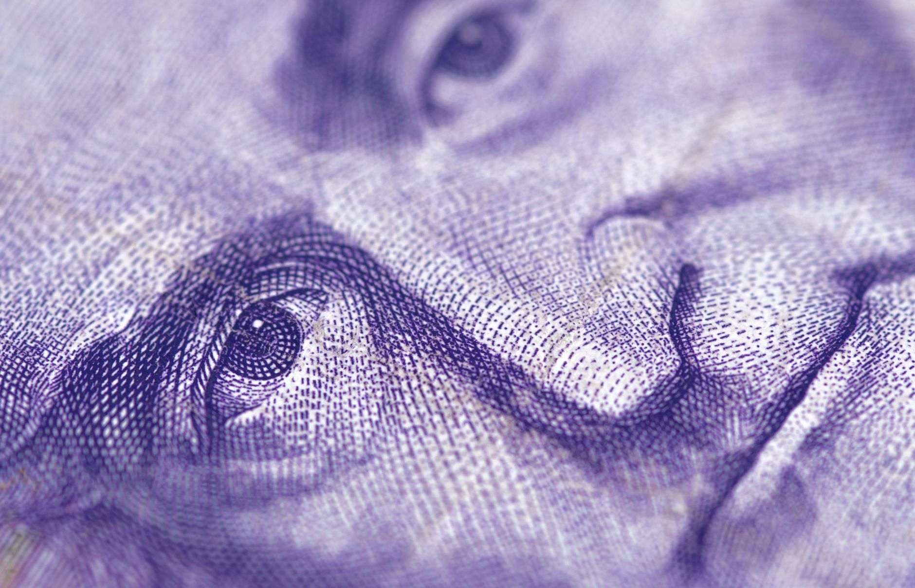 Stock photo of a macro/close-up photograph of engraved portrait line art on paper currency from Pexls.com