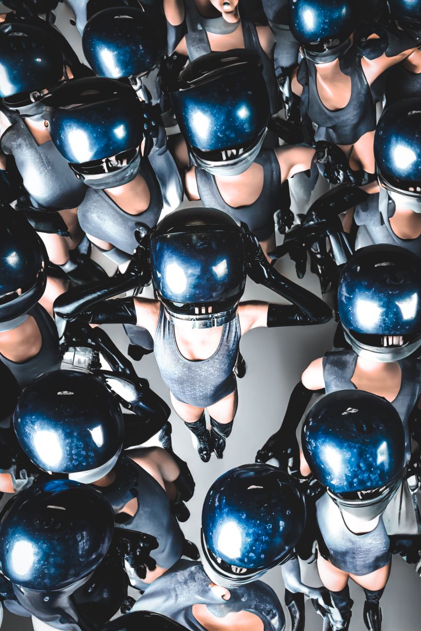 Stock photo shows an AI-generated digital art composition featuring multiple mannequin-like figures wearing glossy blue helmets in a tight, top-down or aerial formation from Pexels.com