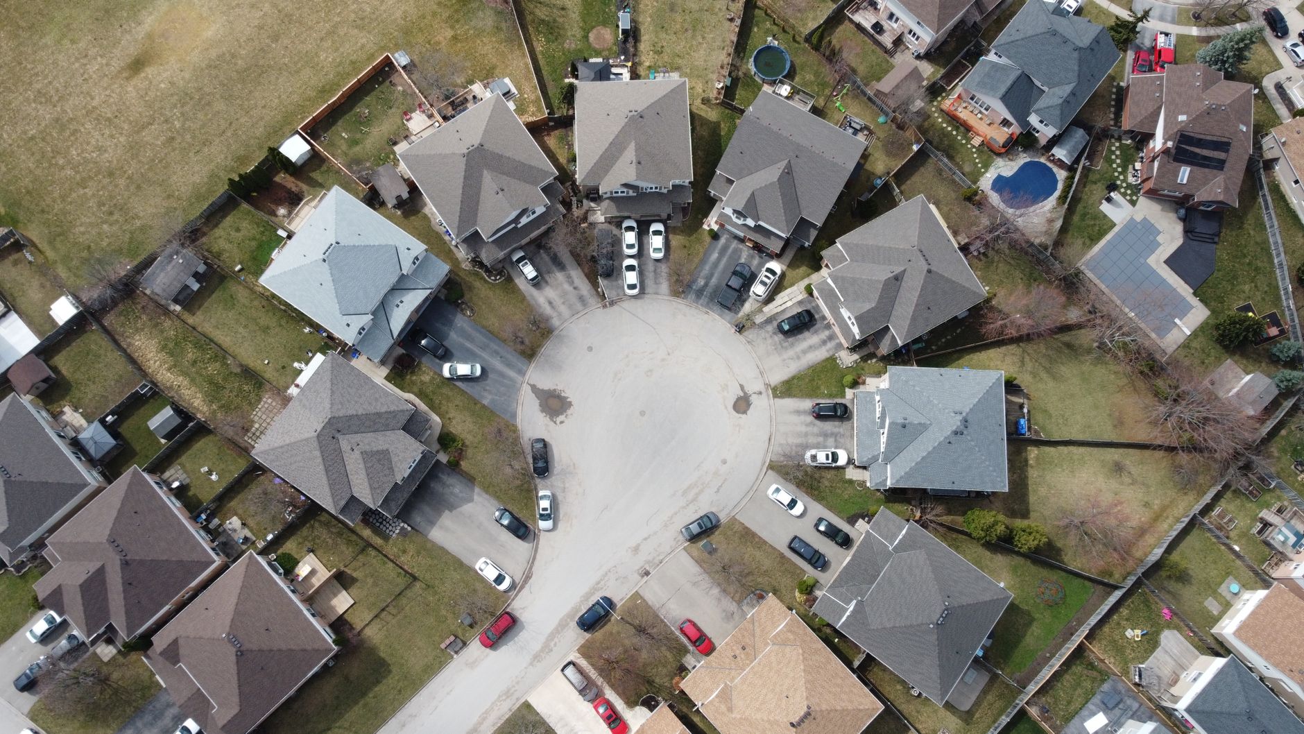 Aerial drone stock photograph of a suburban residential cul-de-sac from Pexel.com